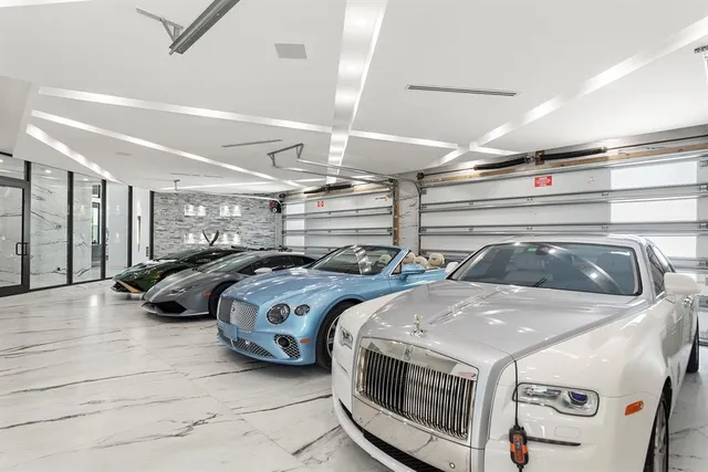 a living room with furniture a rug and a large window