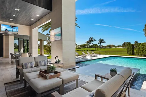 a lobby with furniture and floor to ceiling window