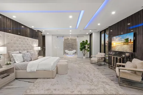 a bathroom with a shower sink and mirror