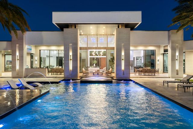 a living room with fireplace furniture and a rug