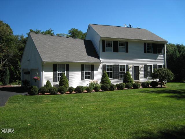 8 Vintage Road Trumbull, CT 06611 - Photo 1 of 1 a front view of a house with a yard