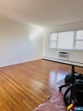 a view of a room with wooden floor and sink