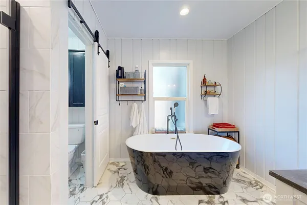 a room with a table and chairs