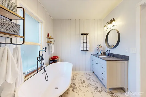 a bathroom with a sink double vanity and a mirror
