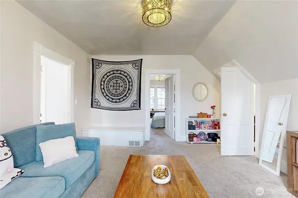 a living room with furniture and a table