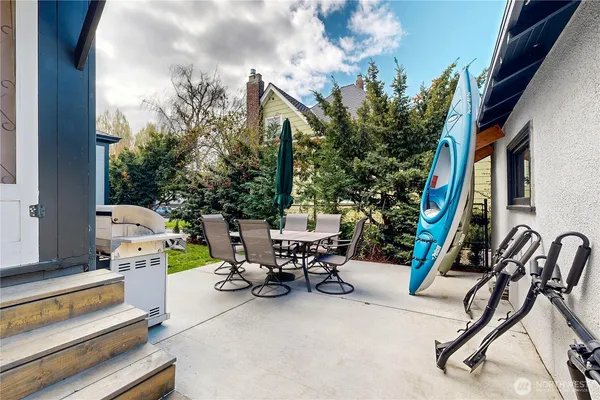 a view of a house with swimming pool and sitting area