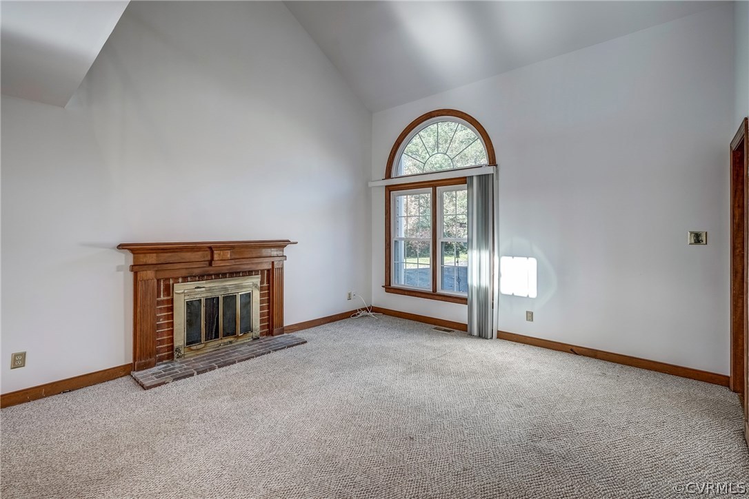 6205 Lansgate Road Midlothian, VA 23112 - Photo 17 of 50 an empty room with windows and fireplace