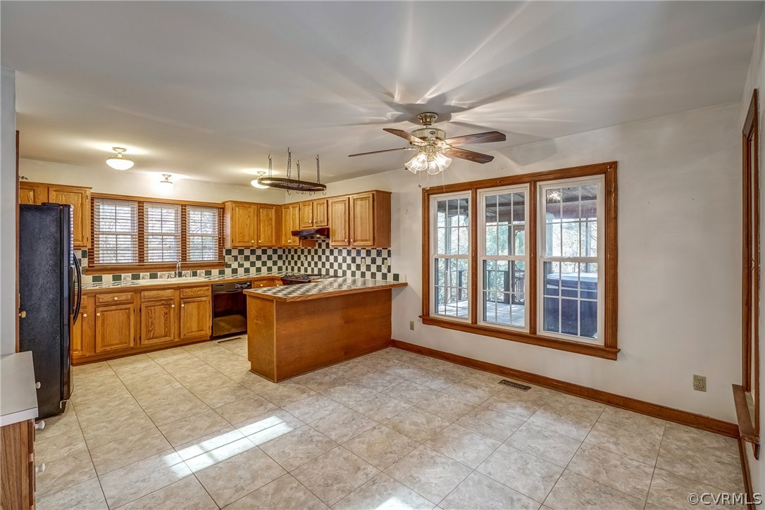 6205 Lansgate Road Midlothian, VA 23112 - Photo 23 of 50 a large kitchen with a stove kitchen island a sink and a large window