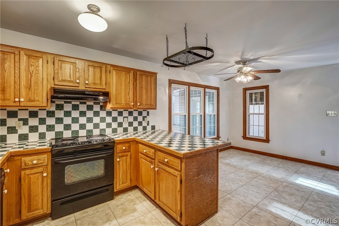 6205 Lansgate Road Midlothian, VA 23112 - Photo 27 of 50 a kitchen with stainless steel appliances granite countertop a stove a sink and a refrigerator