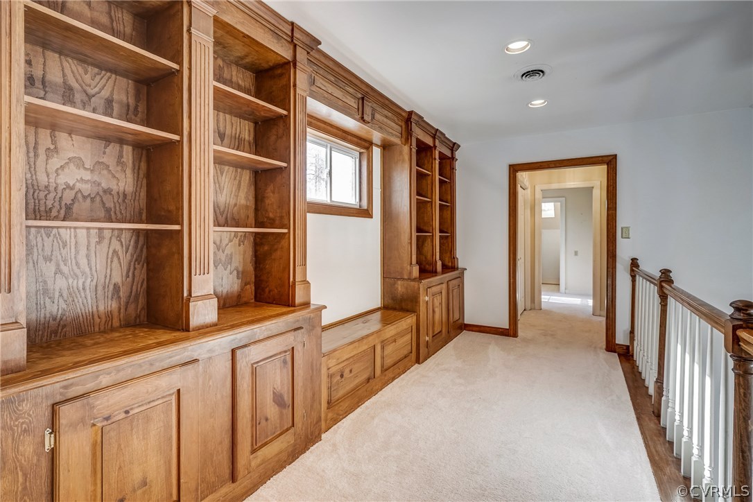 6205 Lansgate Road Midlothian, VA 23112 - Photo 31 of 50 a hallway with white cabinets and wooden floor