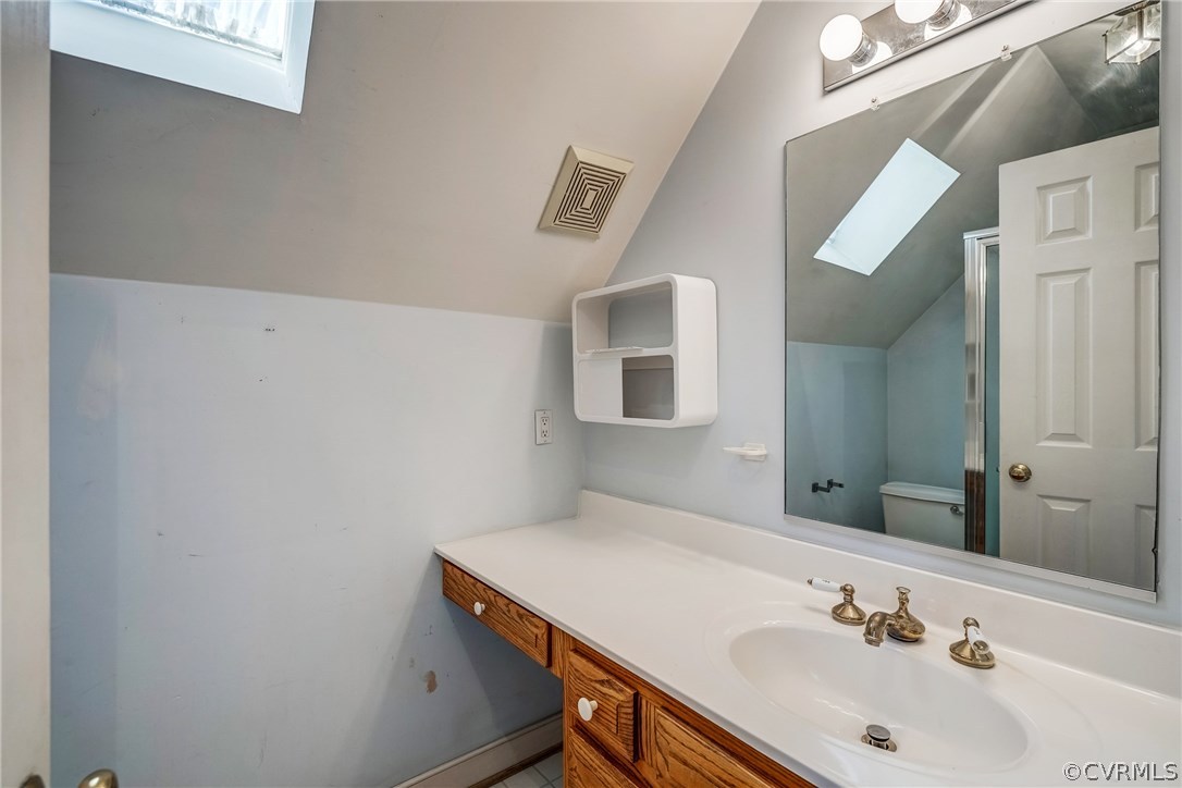 6205 Lansgate Road Midlothian, VA 23112 - Photo 36 of 50 a bathroom with a sink and a mirror