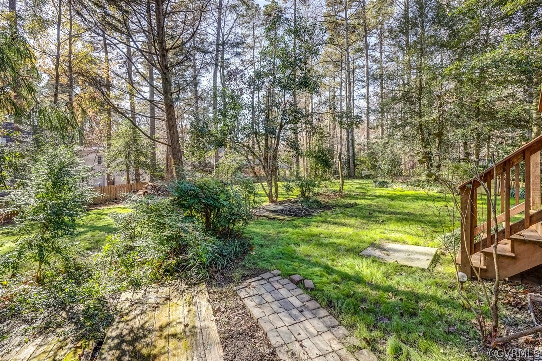 6205 Lansgate Road Midlothian, VA 23112 - Photo 49 of 50 a view of a grassy area with large trees