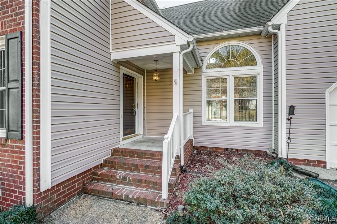 6205 Lansgate Road Midlothian, VA 23112 - Photo 5 of 50 a view of house with wooden stairs and a window