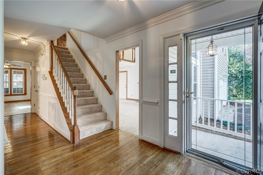 6205 Lansgate Road Midlothian, VA 23112 - Photo 7 of 50 a view of a hallway with wooden floor and entryway