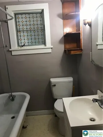 a bedroom with a bed