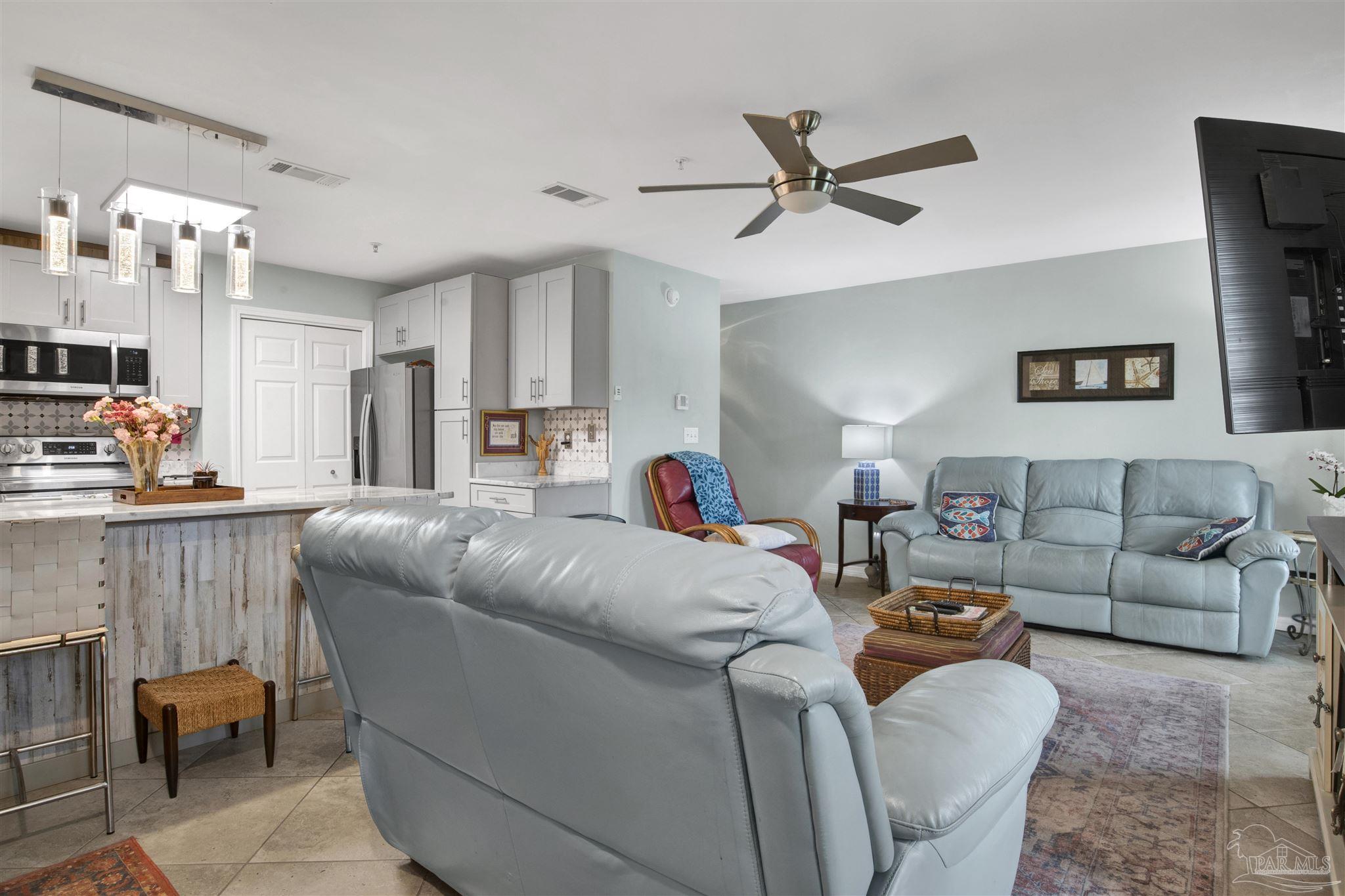 13351 Johnson Beach Road, Unit 203E Perdido Key, FL 32507 - Photo 7 of 55 a living room with furniture and a ceiling fan