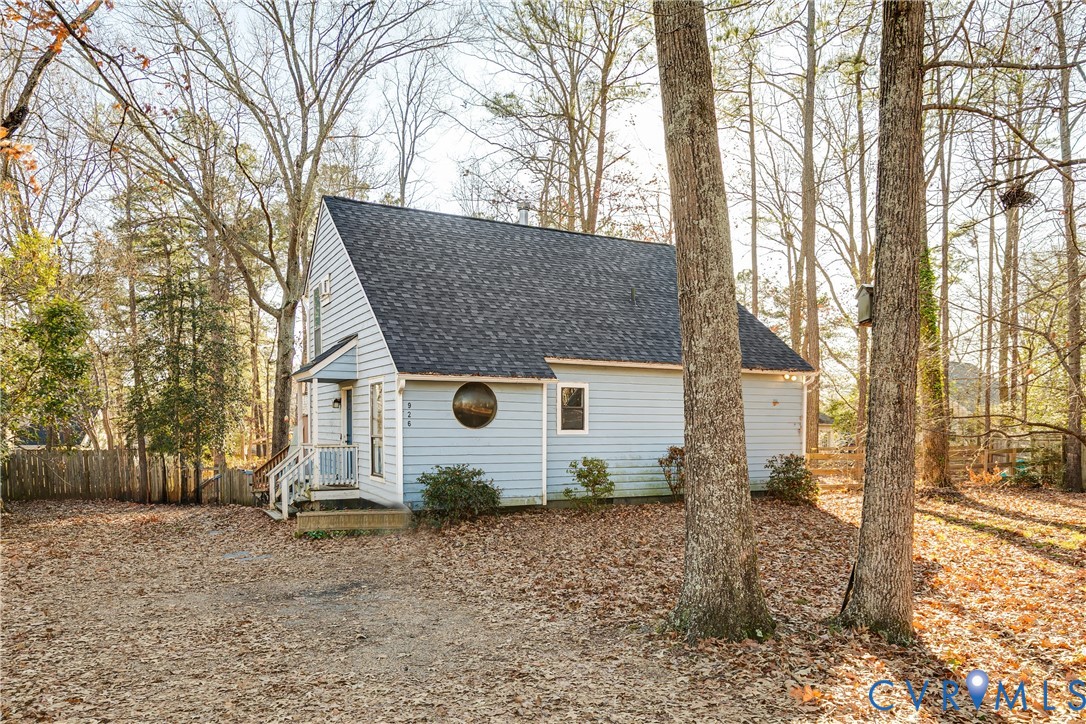 926 Marblethorpe Road North Chesterfield, VA 23236 - Photo 1 of 18 a backyard of a house with barbeque oven tree and wooden fence