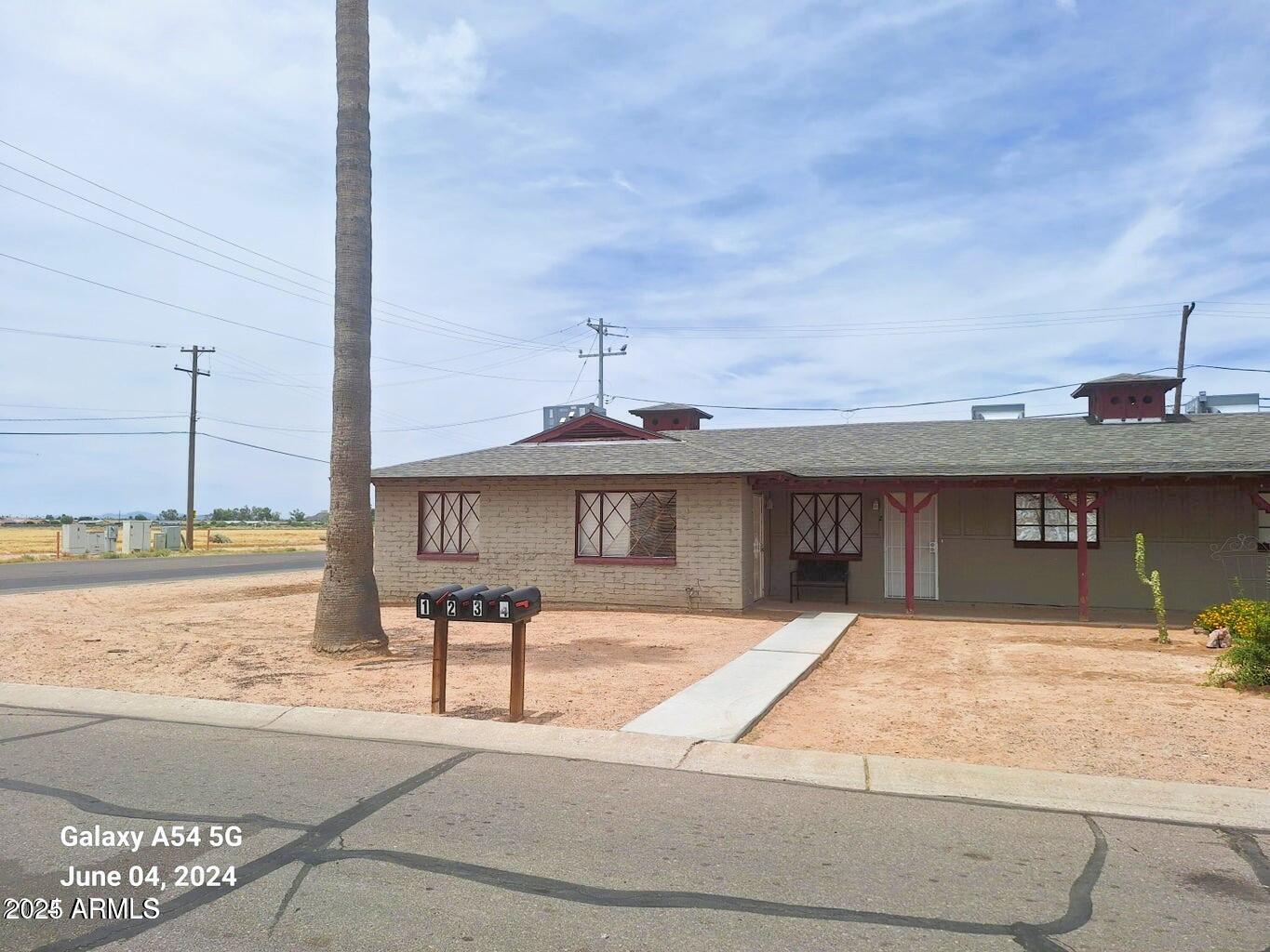 2401 North Amarillo Street, Unit 1 Casa Grande, AZ 85122 - Photo 1 of 14 a view of a swimming pool with an outdoor space and seating area