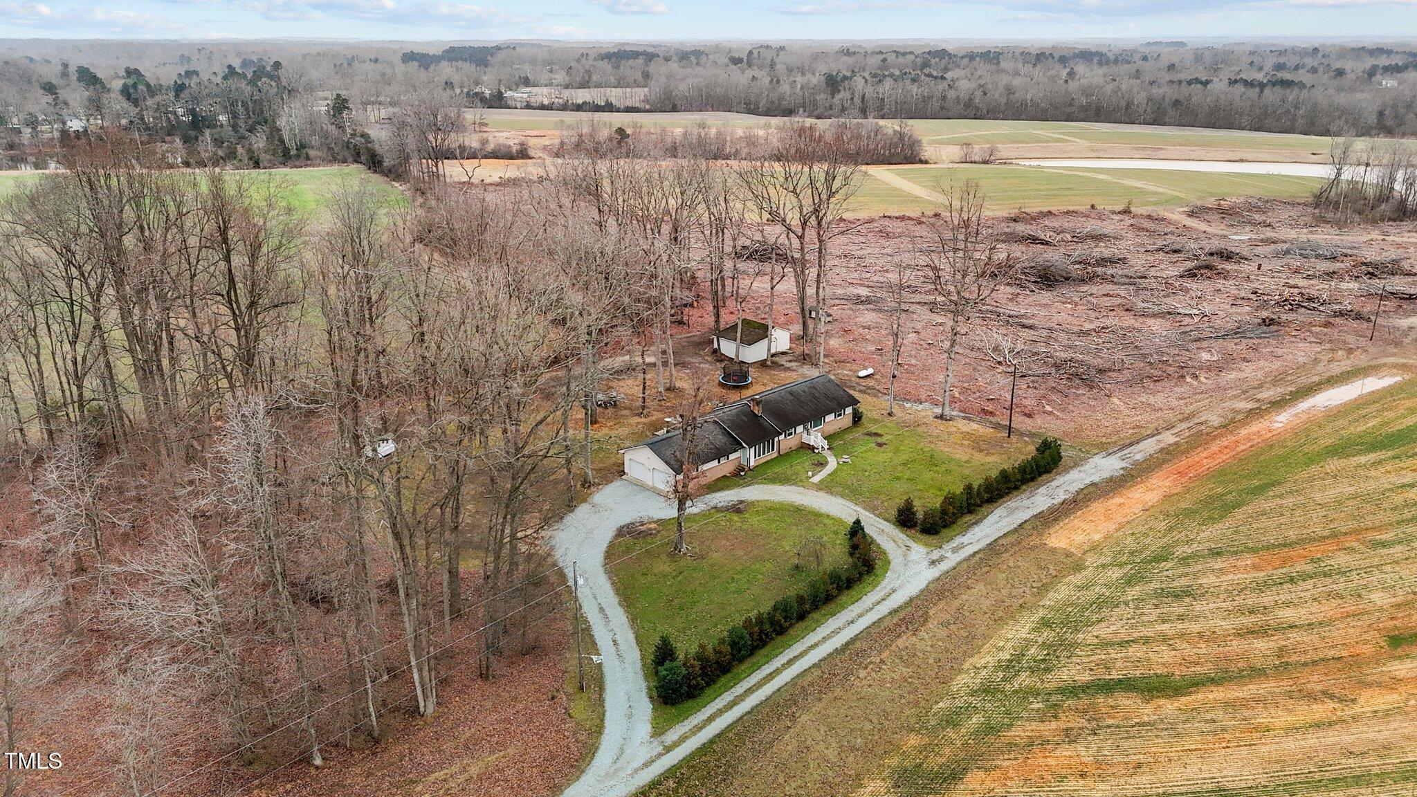 2144 Blalock Dairy Road Roxboro, NC 27574 - Photo 9 of 42 a view of a lake from a yard