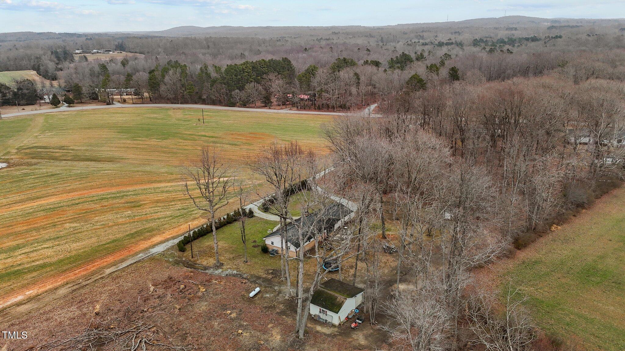 2144 Blalock Dairy Road Roxboro, NC 27574 - Photo 12 of 42 a view of a yard with an outdoor space