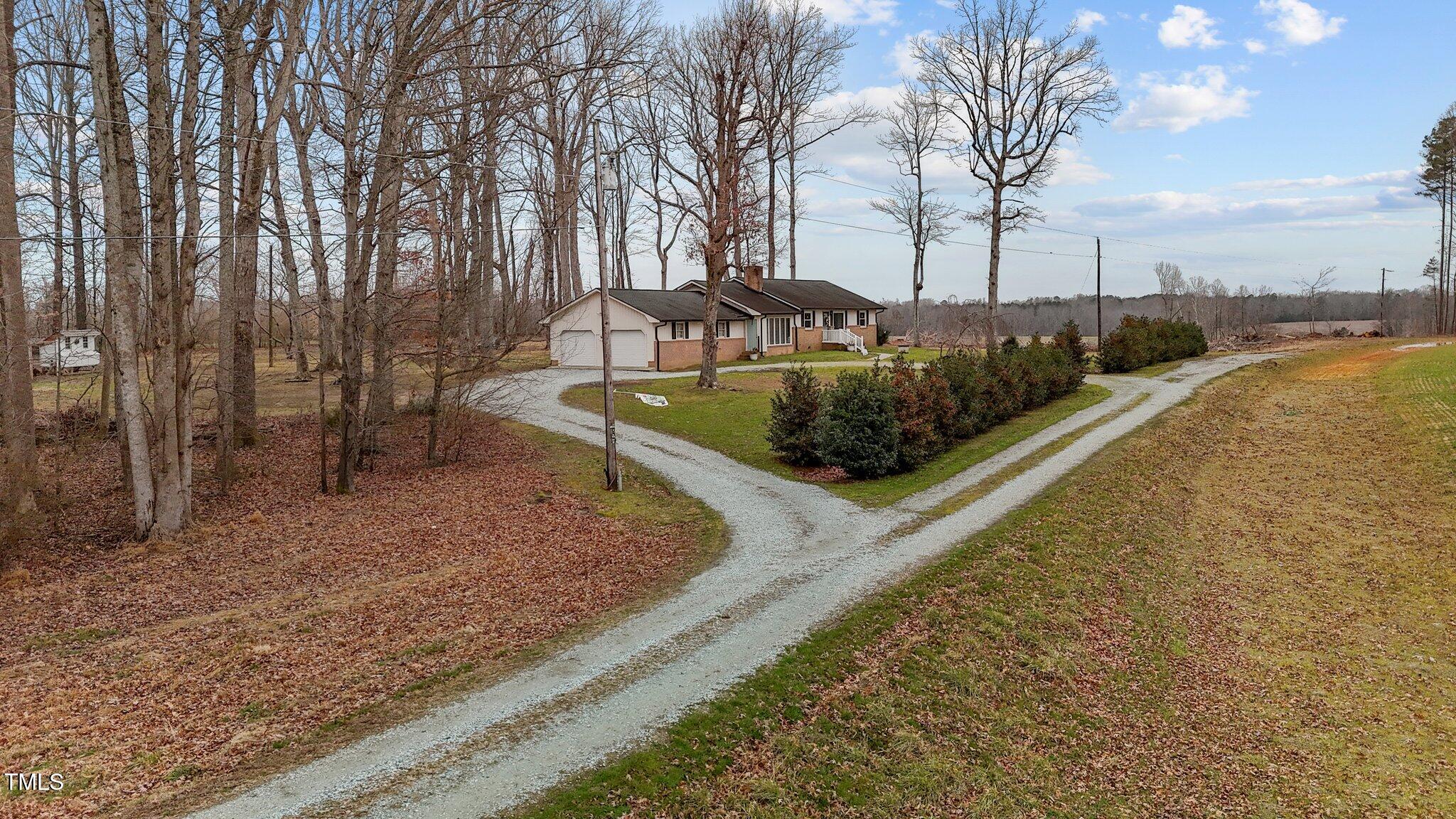 2144 Blalock Dairy Road Roxboro, NC 27574 - Photo 4 of 42 a view of a park with large trees