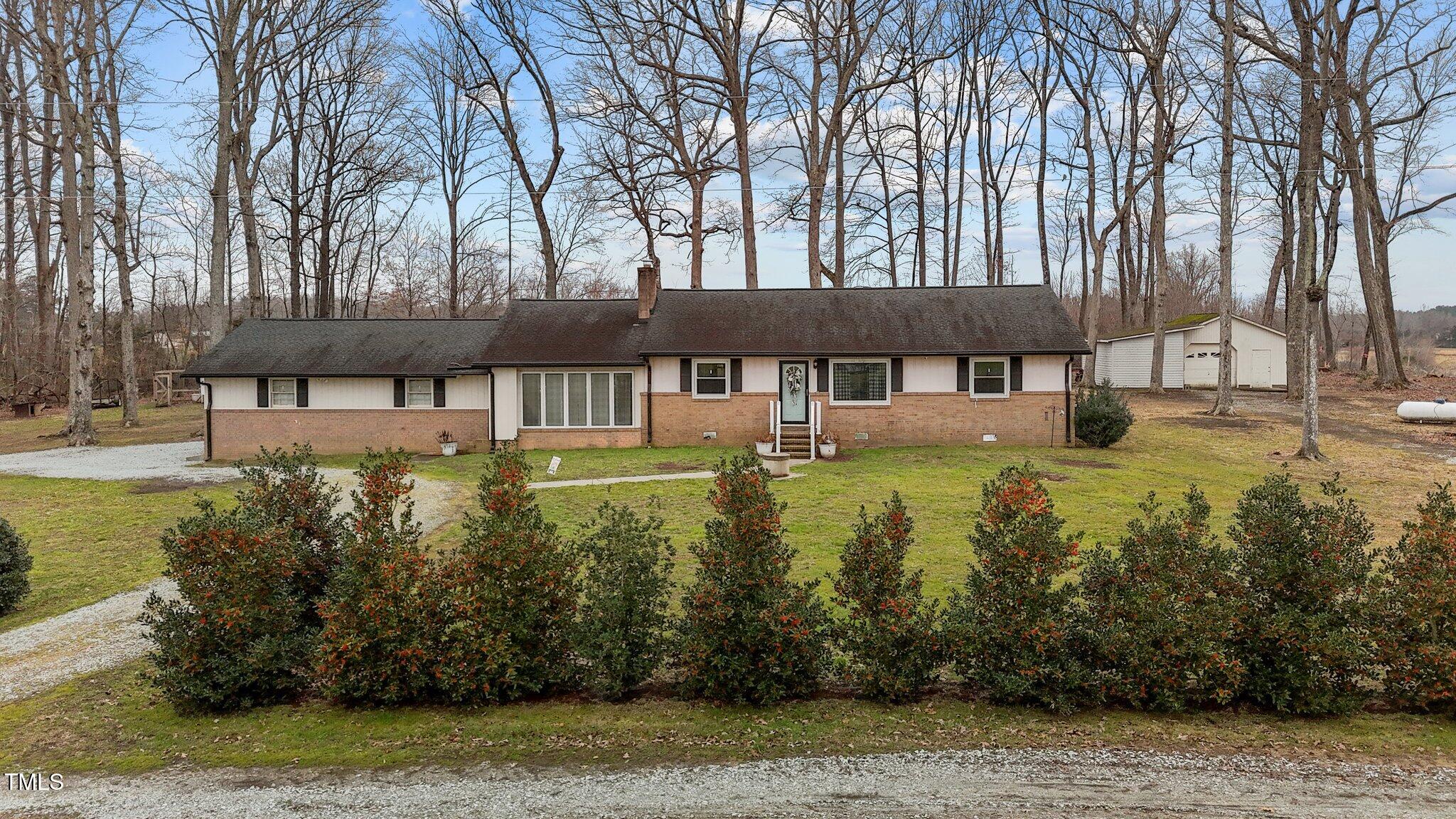 2144 Blalock Dairy Road Roxboro, NC 27574 - Photo 6 of 42 a view of a house with a yard