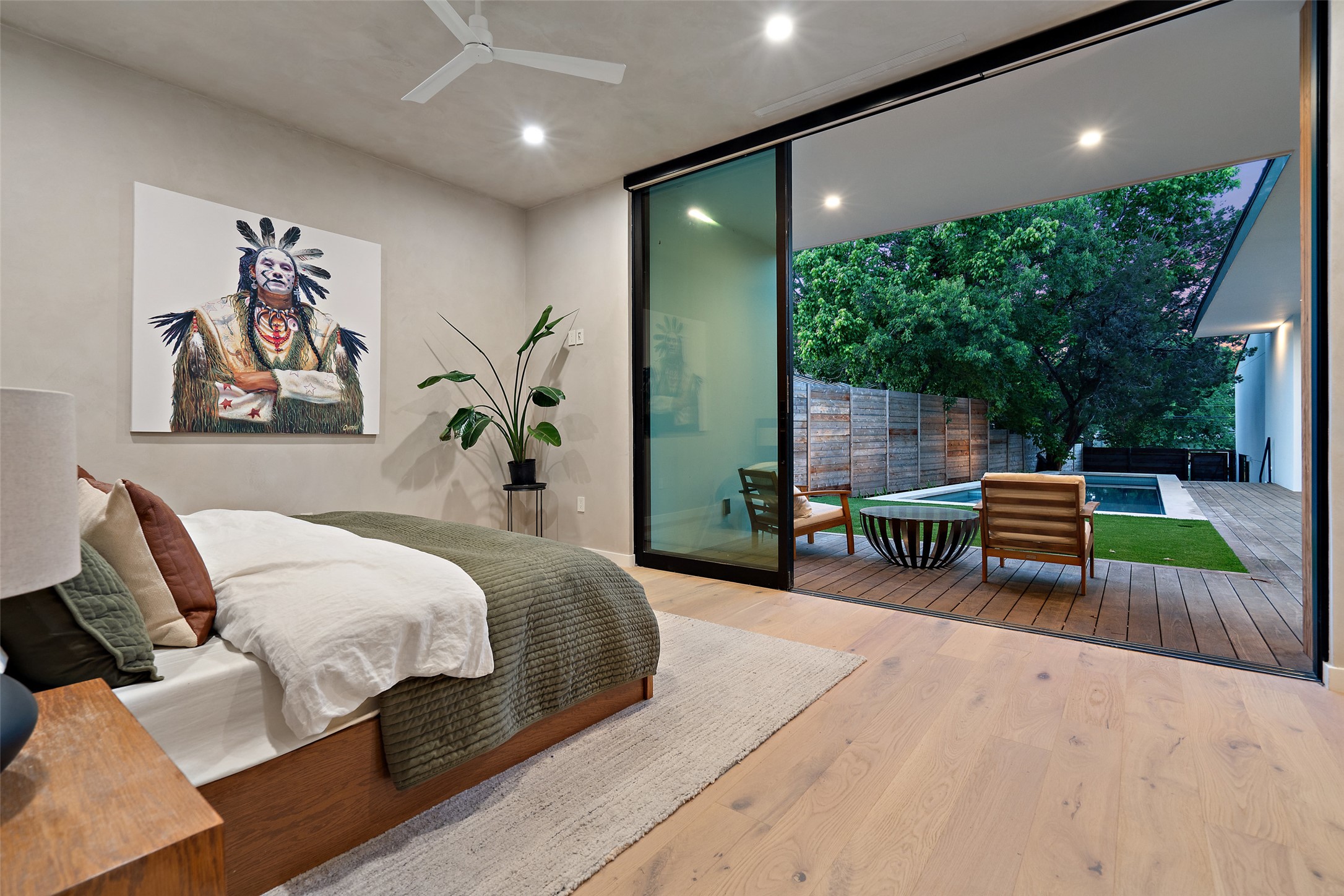 910 West Johanna Street Austin, TX 78704 - Photo 2 of 37 Bedroom featuring expansive windows, light wood-style flooring, recessed lighting, access to outside, and ceiling fan