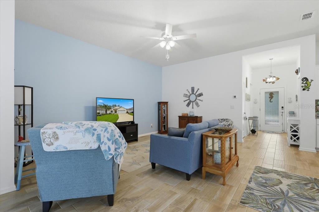 35 Birdie Way Bunnell, FL 32110 - Photo 11 of 57 a living room with furniture and wooden floor