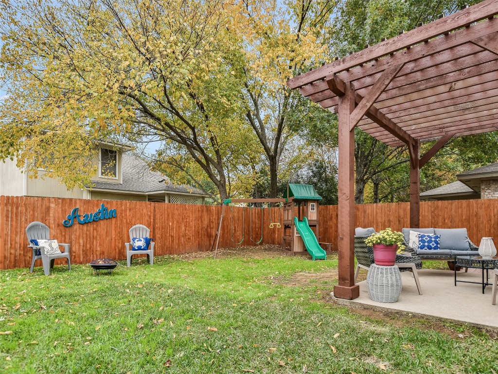 a backyard of a house with table and chairs