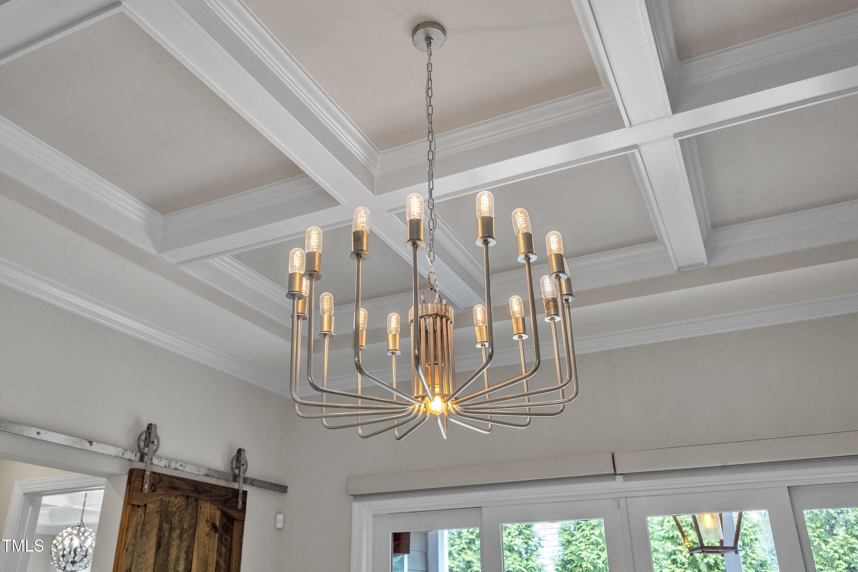 8121 Greys Landing Way Raleigh, NC 27615 - Photo 75 of 95 a view of a living room with a chandelier
