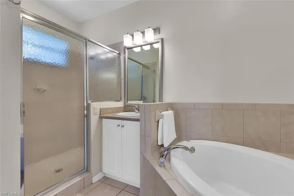a bathroom with a bathtub and shower