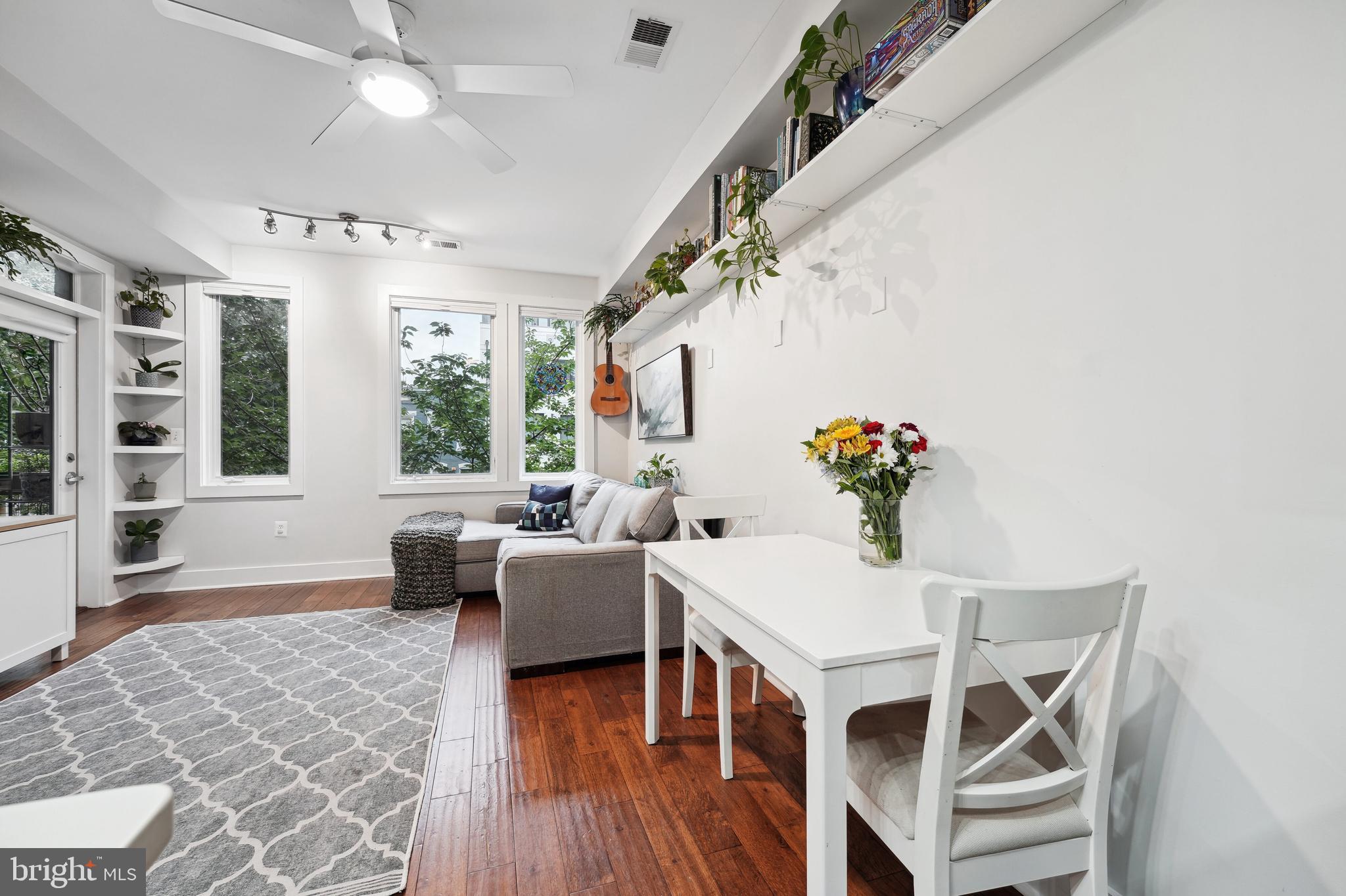 245 15th Street Southeast, Unit 204 Washington, DC 20003 - Photo 4 of 30 a living room with furniture and a chandelier