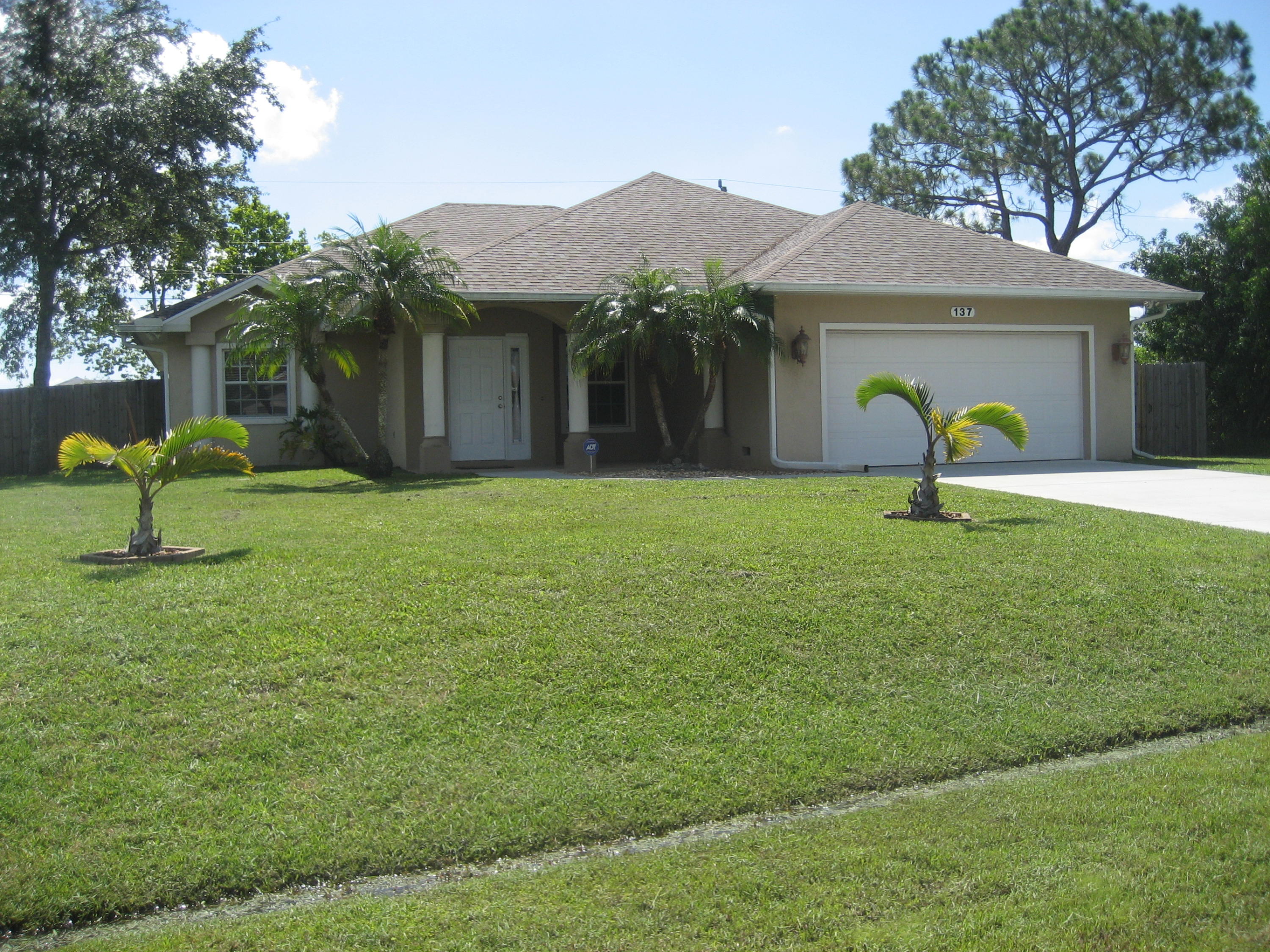 137 Southwest Sea Lion Road Port St. Lucie, FL 34953 - Photo 1 of 20 Front View