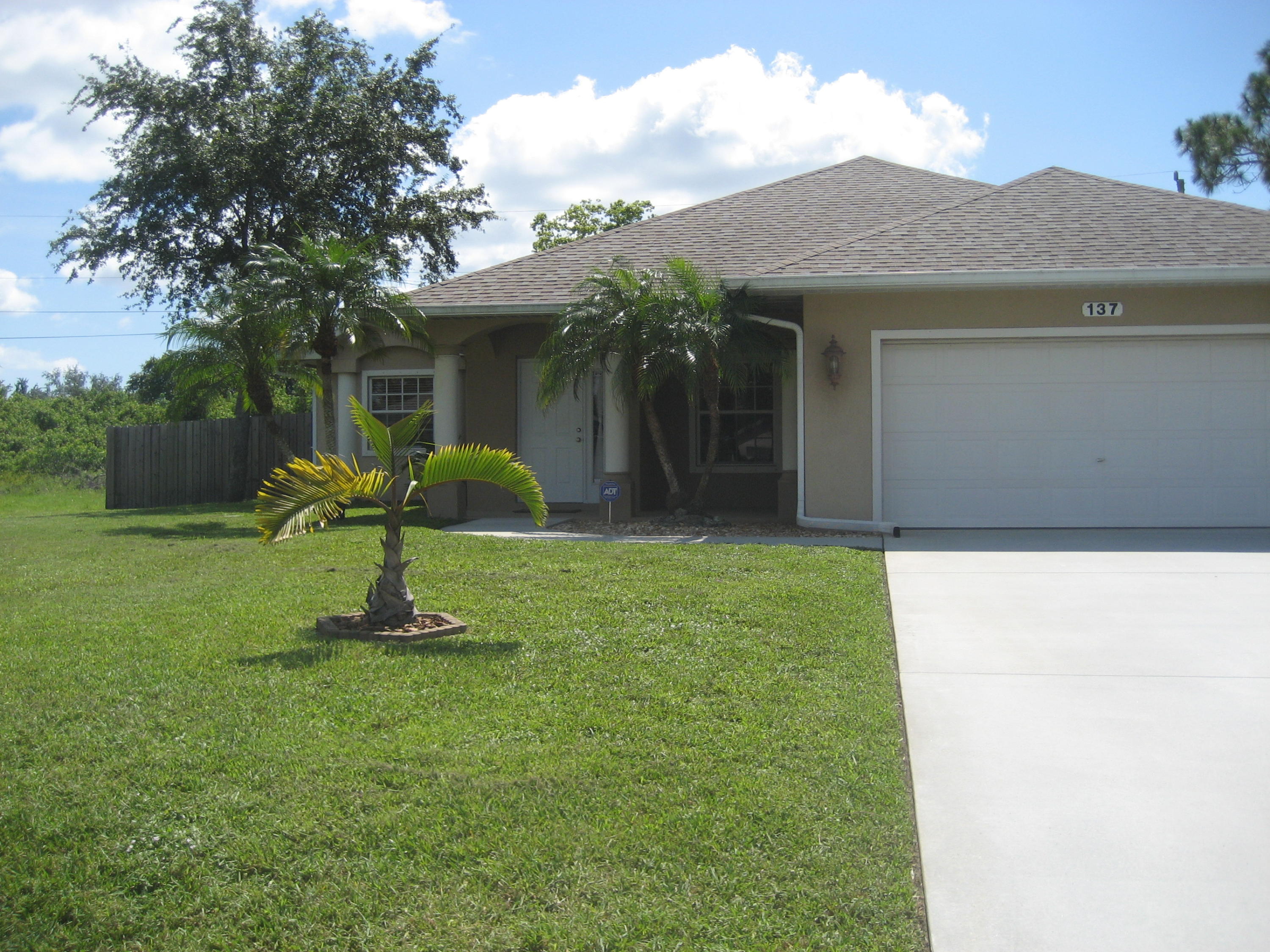 137 Southwest Sea Lion Road Port St. Lucie, FL 34953 - Photo 2 of 20 Front