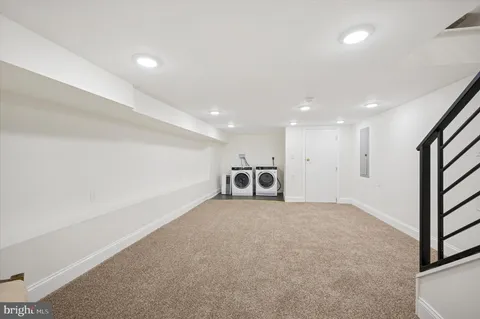 a view of a livingroom with a staircase