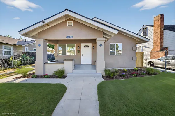 a front view of a house with garden