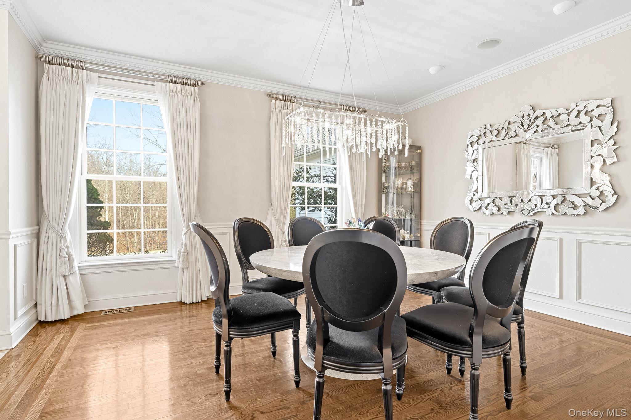 58 Old Logging Road Bedford, NY 10506 - Photo 13 of 34 a view of a dining room with furniture window and wooden floor