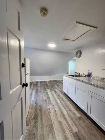 a bathroom with a sink and mirror