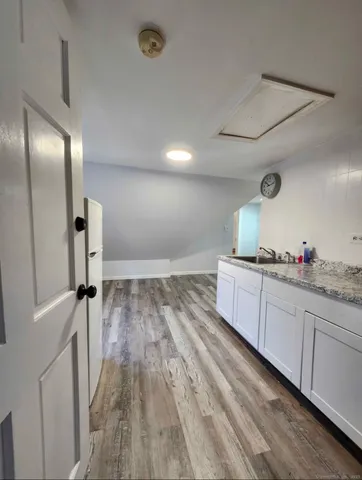 a bathroom with a sink and mirror