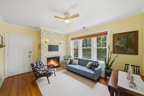a living room with furniture and a fireplace