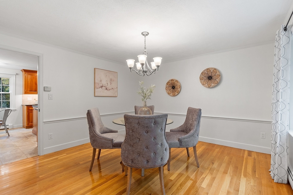 31 Herrick Road Boxford, MA 01921 - Photo 12 of 40 a view of a dining room with furniture and wooden floor