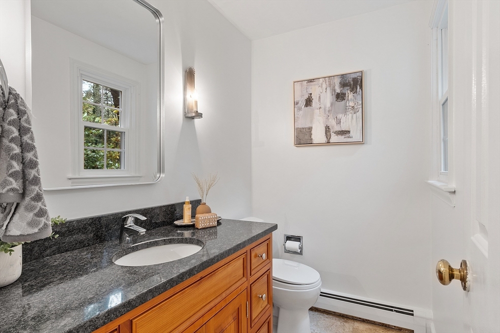 31 Herrick Road Boxford, MA 01921 - Photo 17 of 40 a bathroom with a granite countertop sink and a mirror