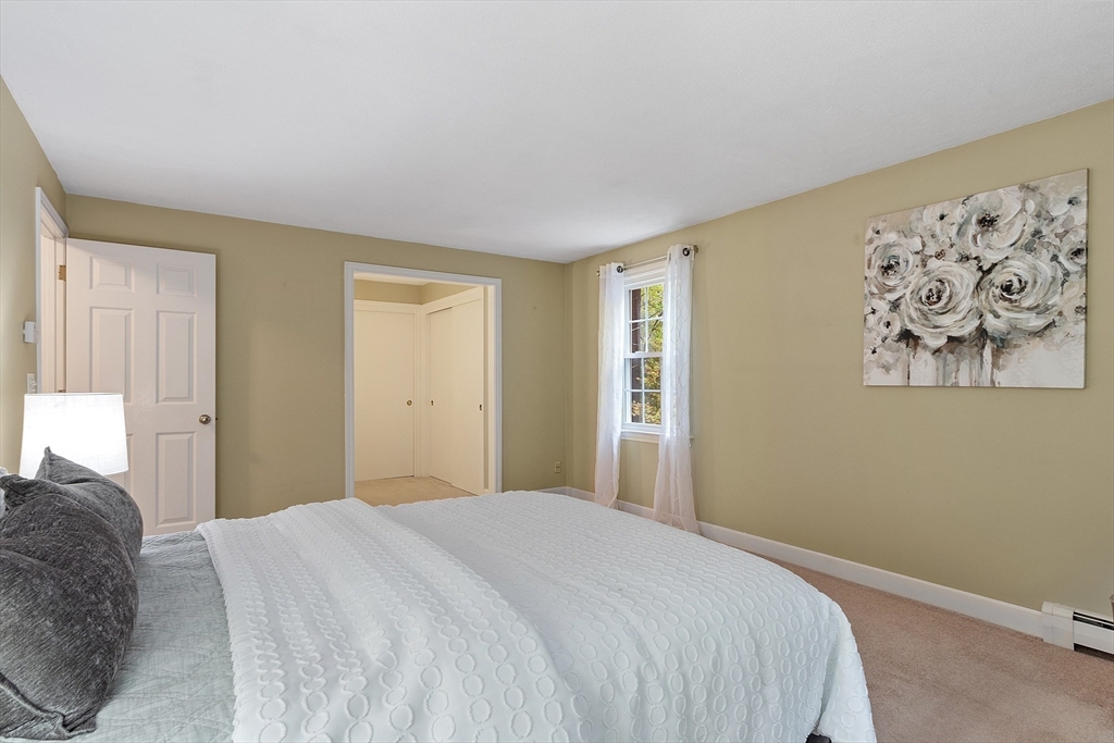 31 Herrick Road Boxford, MA 01921 - Photo 19 of 40 a bedroom with a bed and a window