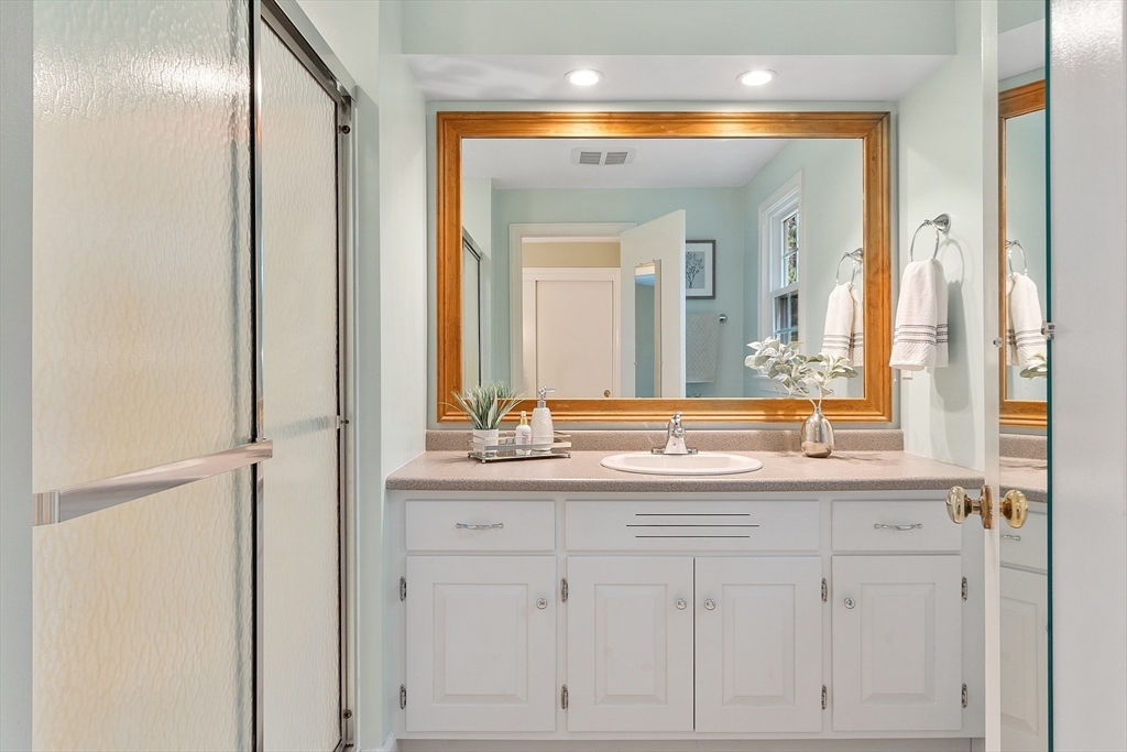 31 Herrick Road Boxford, MA 01921 - Photo 21 of 40 a bathroom with a sink and a mirror