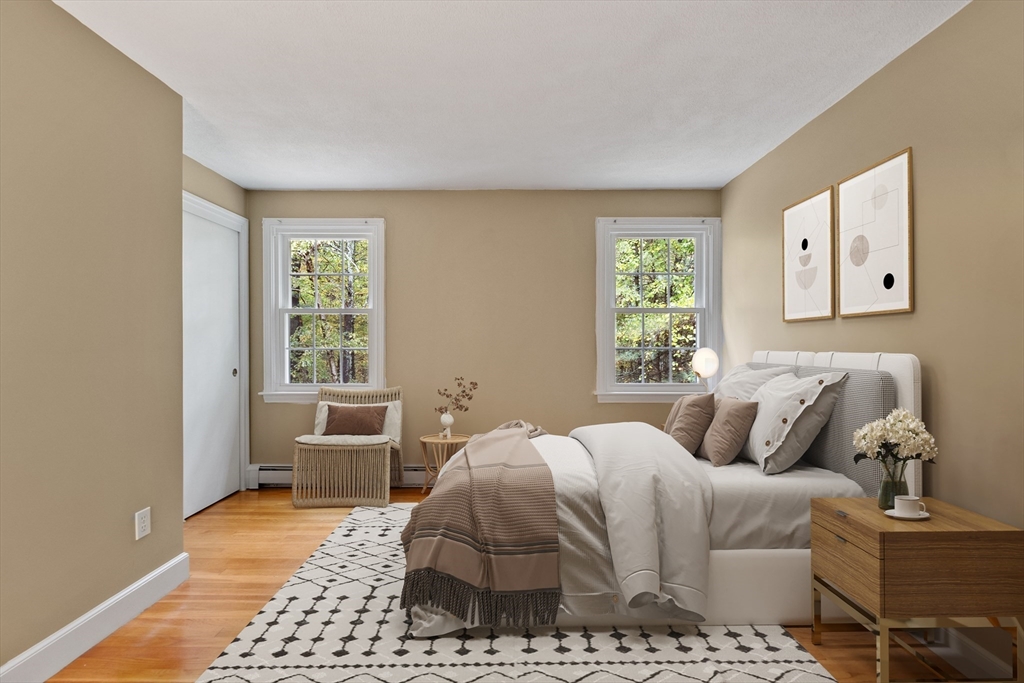 31 Herrick Road Boxford, MA 01921 - Photo 22 of 40 a bedroom with a bed and wooden floor