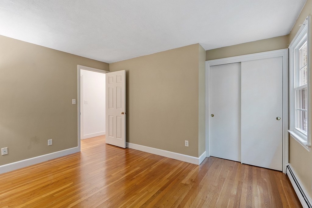 31 Herrick Road Boxford, MA 01921 - Photo 24 of 40 a view of an empty room with wooden floor and a window