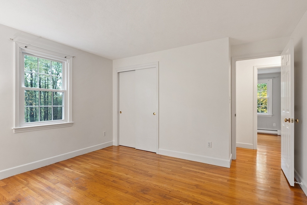 31 Herrick Road Boxford, MA 01921 - Photo 27 of 40 a view of empty room with wooden floor and fan