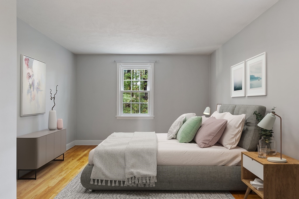 31 Herrick Road Boxford, MA 01921 - Photo 28 of 40 a bedroom with a bed and wooden floor