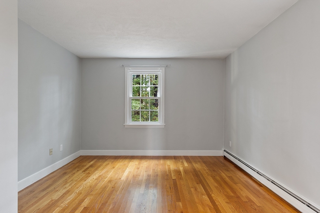 31 Herrick Road Boxford, MA 01921 - Photo 29 of 40 a view of empty room with wooden floor and fan