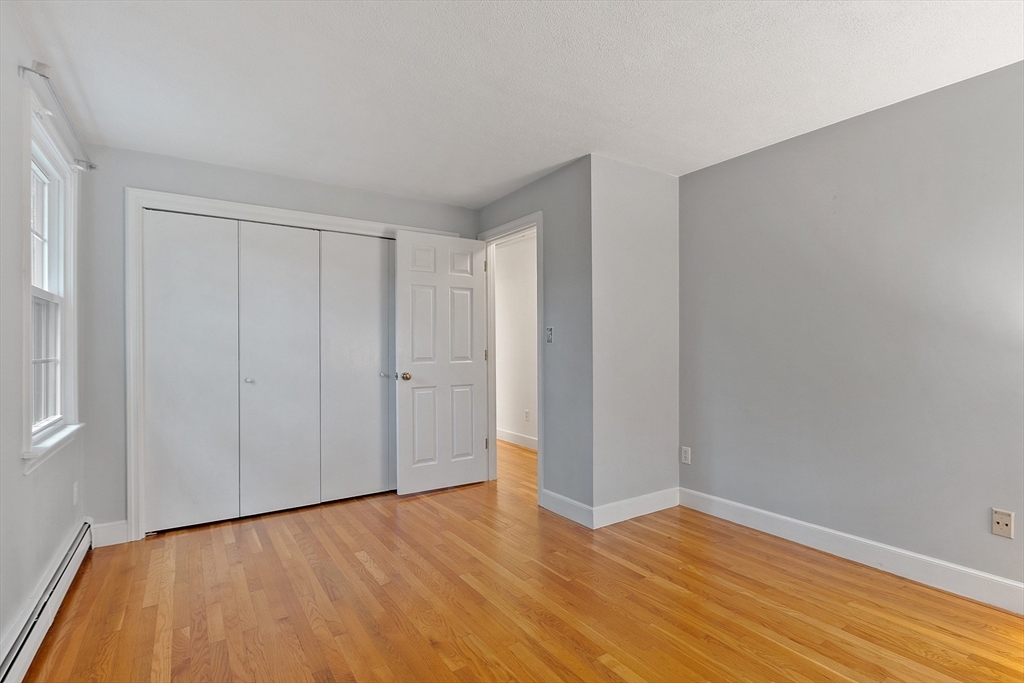 31 Herrick Road Boxford, MA 01921 - Photo 30 of 40 a view of an empty room with wooden floor